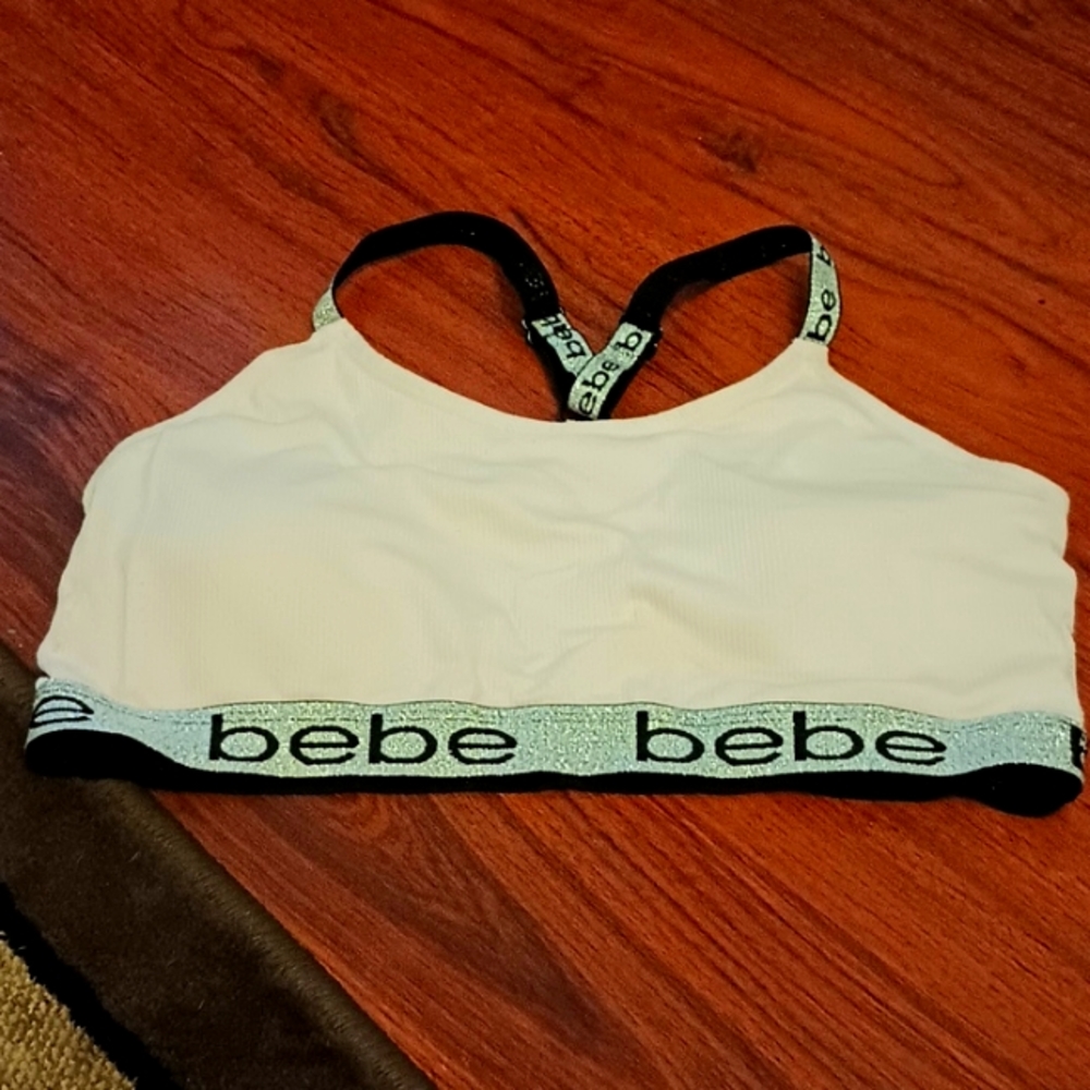 bebe light pink with silver glitter highlights sports bra.